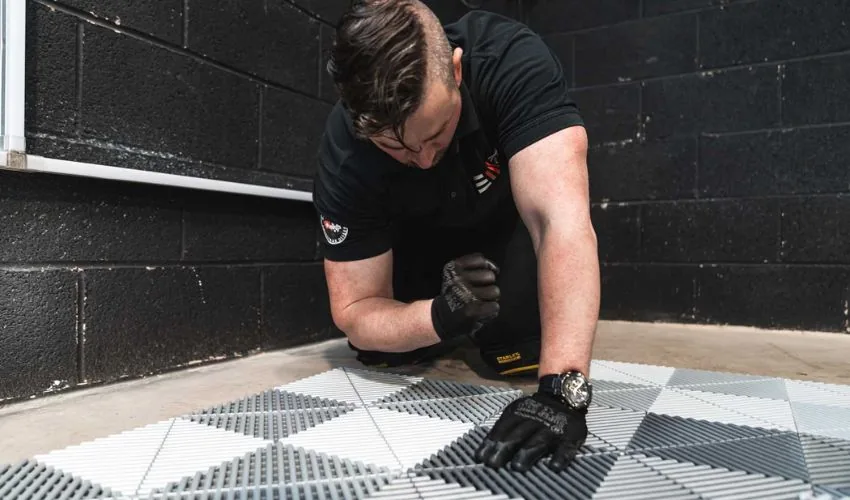 Garage floor installation process in progress quickly